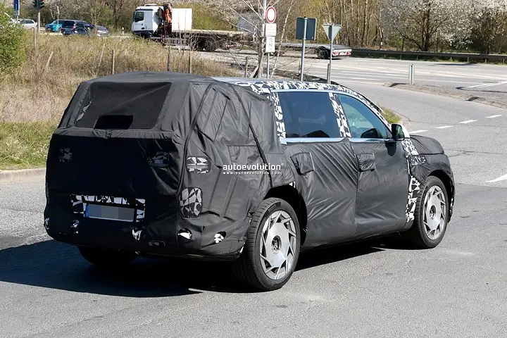 2026-genesis-gv90-electric-flagship-suv-spied-charging-looks-massive_15