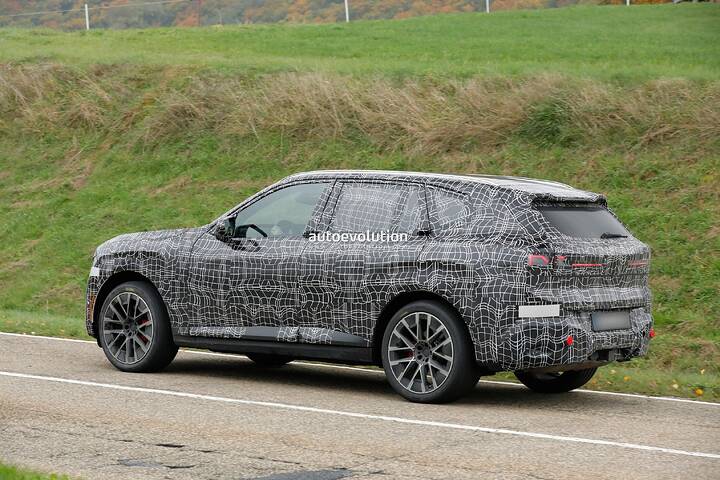 imgi_86_bmws-new-2028-x5-wears-neue-klasse-attire-beneath-trippy-vinyl-stickers_27