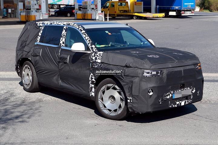 2026-genesis-gv90-electric-flagship-suv-spied-charging-looks-massive_9