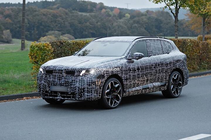 imgi_76_bmws-new-2028-x5-wears-neue-klasse-attire-beneath-trippy-vinyl-stickers_17