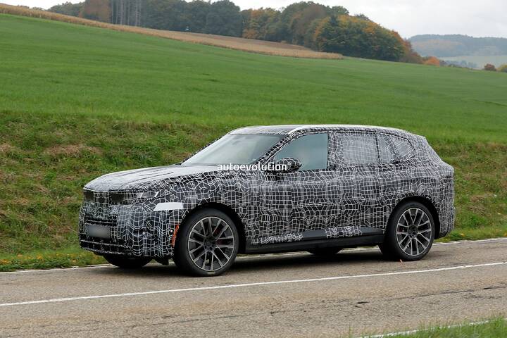 imgi_84_bmws-new-2028-x5-wears-neue-klasse-attire-beneath-trippy-vinyl-stickers_25