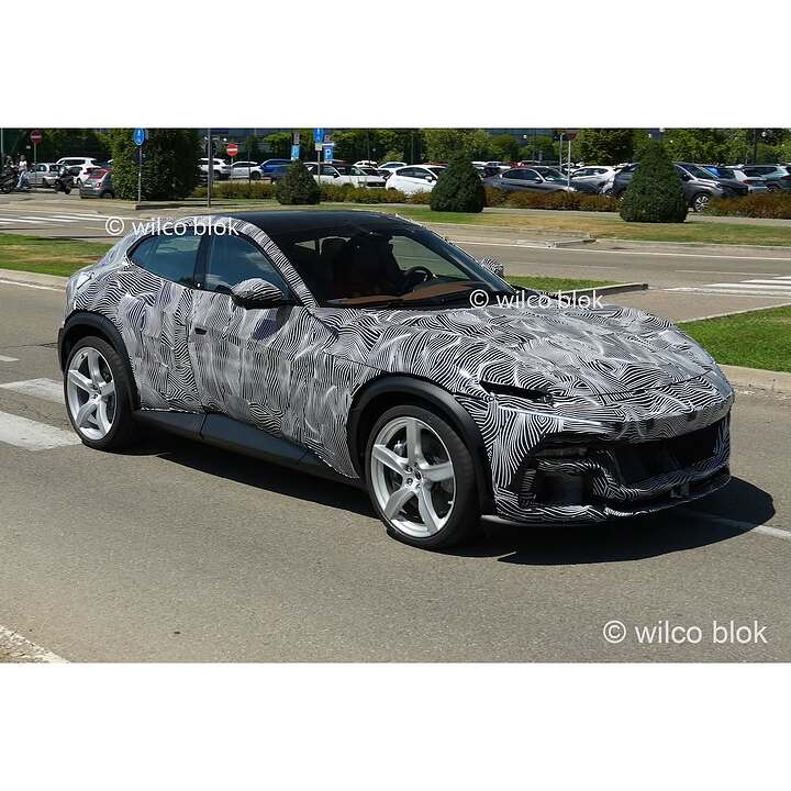 Fully camouflaged Ferrari Purosangue spotted in Maranello!What is Ferrari cooking Could this be (1)