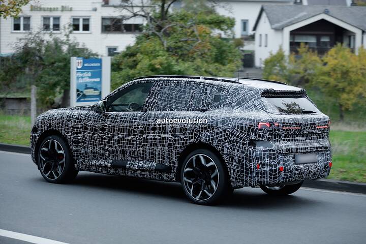 imgi_79_bmws-new-2028-x5-wears-neue-klasse-attire-beneath-trippy-vinyl-stickers_20