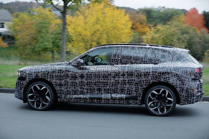 imgi_78_bmws-new-2028-x5-wears-neue-klasse-attire-beneath-trippy-vinyl-stickers_19