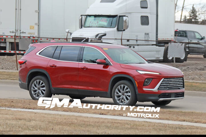 2025-buick-enclave-prototype-spy-shots-no-camouflage-red-february-2024-exterior-002-side-front-three-quarters