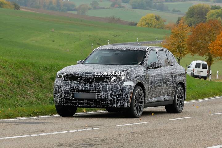 imgi_83_bmws-new-2028-x5-wears-neue-klasse-attire-beneath-trippy-vinyl-stickers_24