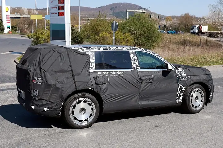 2026-genesis-gv90-electric-flagship-suv-spied-charging-looks-massive_13