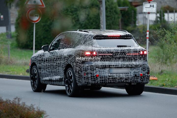 imgi_80_bmws-new-2028-x5-wears-neue-klasse-attire-beneath-trippy-vinyl-stickers_21