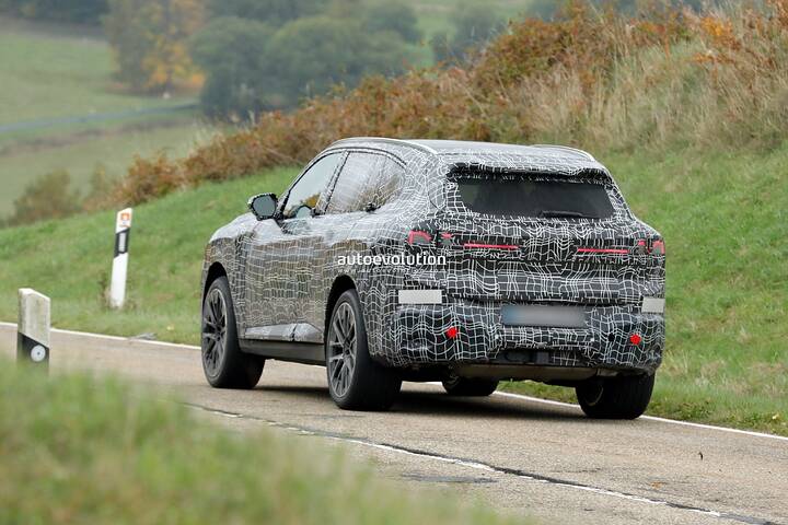 imgi_89_bmws-new-2028-x5-wears-neue-klasse-attire-beneath-trippy-vinyl-stickers_30