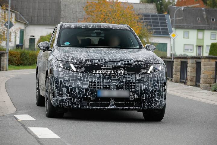 imgi_91_bmws-new-2028-x5-wears-neue-klasse-attire-beneath-trippy-vinyl-stickers_32