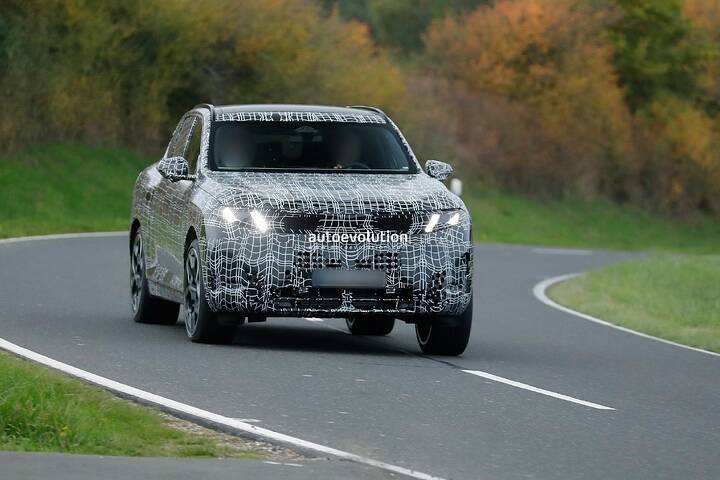 imgi_60_bmws-new-2028-x5-wears-neue-klasse-attire-beneath-trippy-vinyl-stickers_1