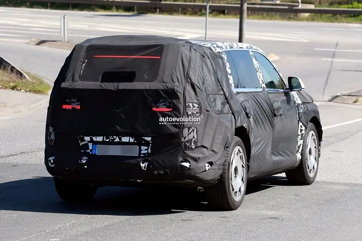 2026-genesis-gv90-electric-flagship-suv-spied-charging-looks-massive_19