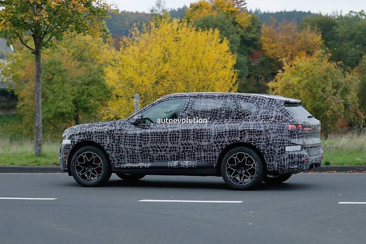 imgi_70_bmws-new-2028-x5-wears-neue-klasse-attire-beneath-trippy-vinyl-stickers_11