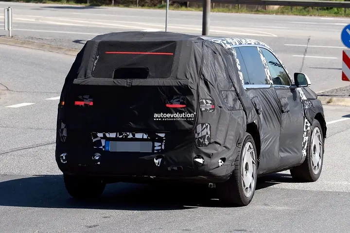 2026-genesis-gv90-electric-flagship-suv-spied-charging-looks-massive_20