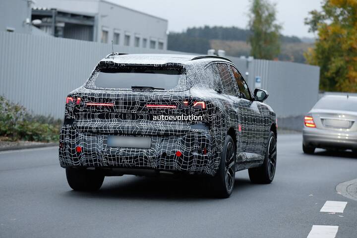 imgi_73_bmws-new-2028-x5-wears-neue-klasse-attire-beneath-trippy-vinyl-stickers_14