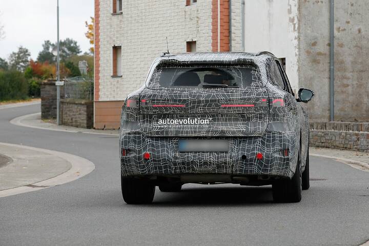 imgi_93_bmws-new-2028-x5-wears-neue-klasse-attire-beneath-trippy-vinyl-stickers_34