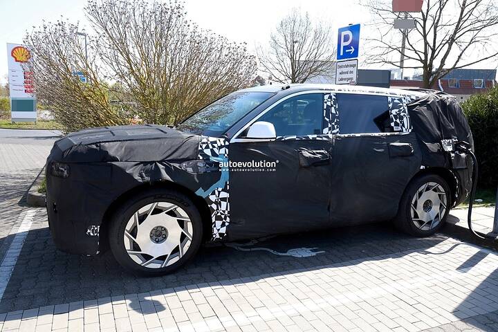 2026-genesis-gv90-electric-flagship-suv-spied-charging-looks-massive_1