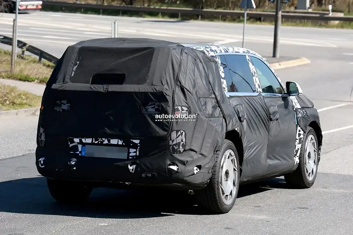2026-genesis-gv90-electric-flagship-suv-spied-charging-looks-massive_18
