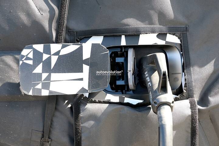 2026-genesis-gv90-electric-flagship-suv-spied-charging-looks-massive_2