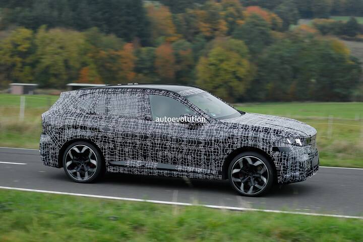 imgi_63_bmws-new-2028-x5-wears-neue-klasse-attire-beneath-trippy-vinyl-stickers_4