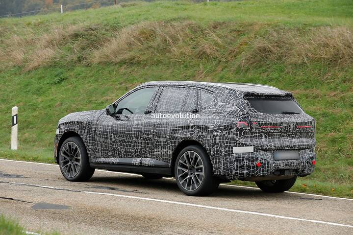 imgi_87_bmws-new-2028-x5-wears-neue-klasse-attire-beneath-trippy-vinyl-stickers_28