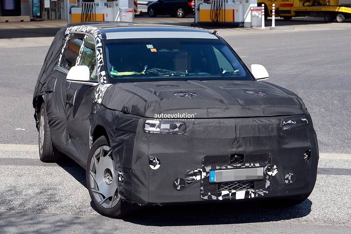 2026-genesis-gv90-electric-flagship-suv-spied-charging-looks-massive_6
