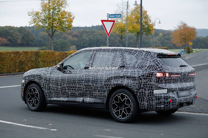 imgi_68_bmws-new-2028-x5-wears-neue-klasse-attire-beneath-trippy-vinyl-stickers_9