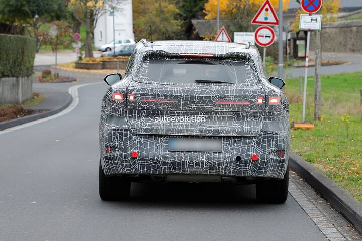 imgi_95_bmws-new-2028-x5-wears-neue-klasse-attire-beneath-trippy-vinyl-stickers_36