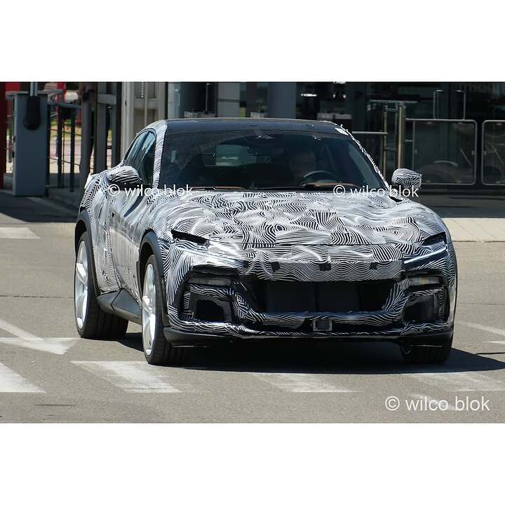 Fully camouflaged Ferrari Purosangue spotted in Maranello!What is Ferrari cooking Could this be
