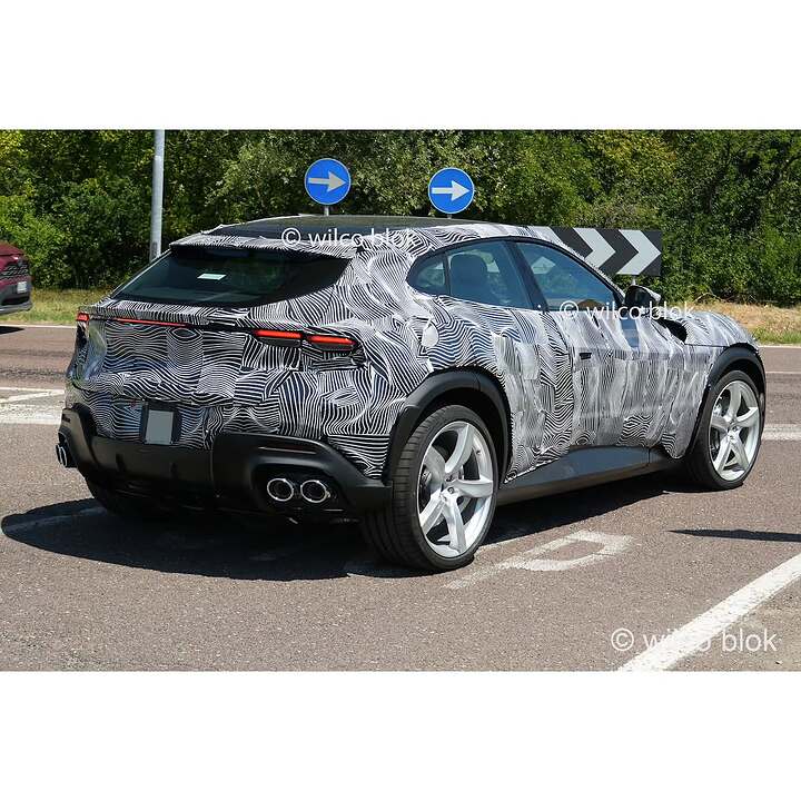 Fully camouflaged Ferrari Purosangue spotted in Maranello!What is Ferrari cooking Could this be (2)