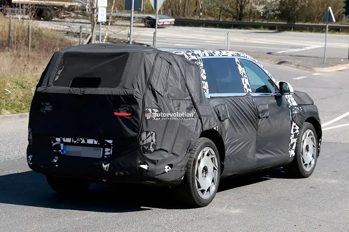 2026-genesis-gv90-electric-flagship-suv-spied-charging-looks-massive_16