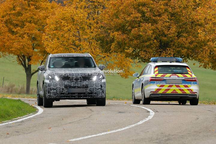 imgi_81_bmws-new-2028-x5-wears-neue-klasse-attire-beneath-trippy-vinyl-stickers_22