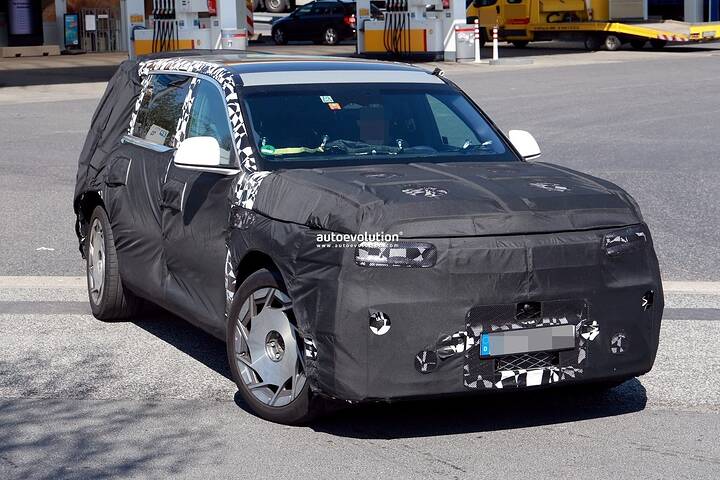 2026-genesis-gv90-electric-flagship-suv-spied-charging-looks-massive_8