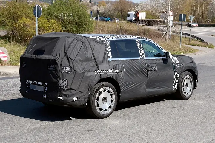 2026-genesis-gv90-electric-flagship-suv-spied-charging-looks-massive_14